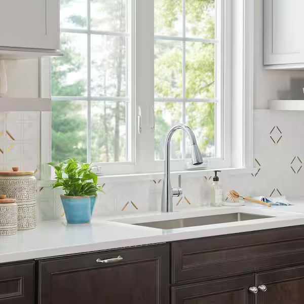 Plumber inspecting pipe connection